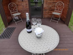Pitch and Canvas | Glamping and Camping in Cheshire | Outdoor furniture with champagne