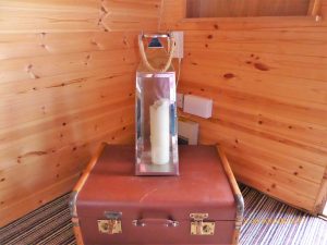 Pitch and Canvas | Glamping and Camping in Cheshire | Lamp and suitcase in luxury pod