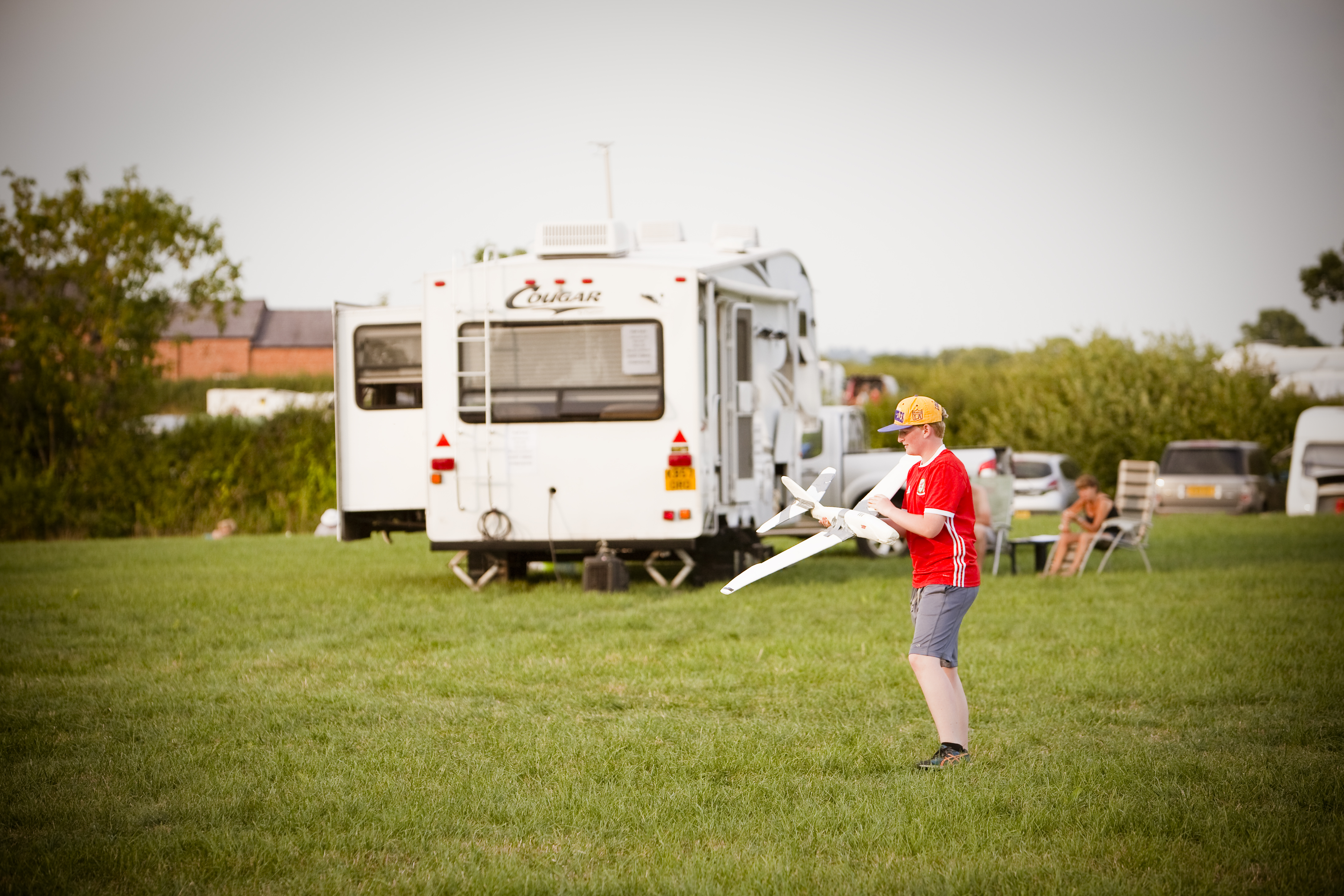 Pitch and Canvas | Glamping and Camping in Cheshire | boy playing with plane