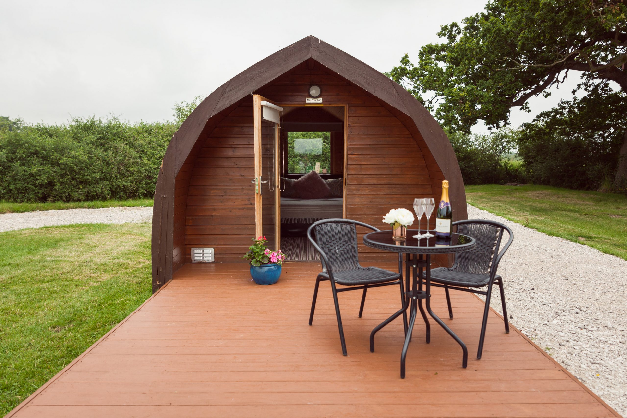 Pitch and Canvas | Glamping and Camping in Cheshire | Pod, outdoor table, wine